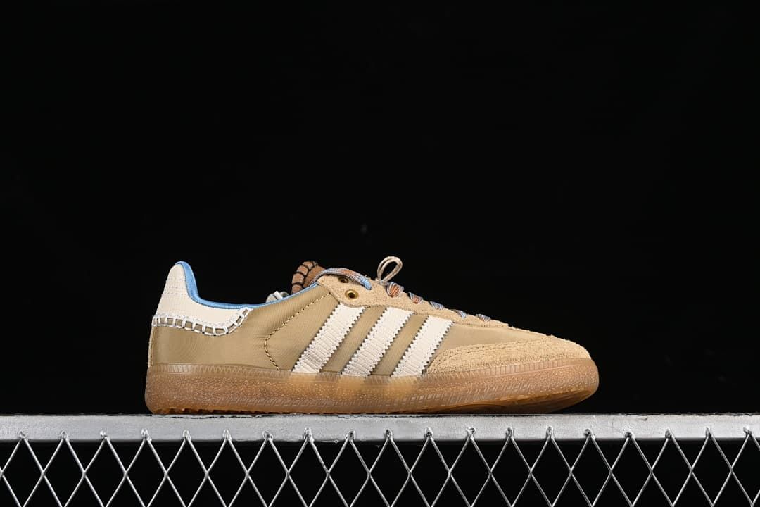 Side profile showing the tan upper, cream stripes, and gum-colored sole