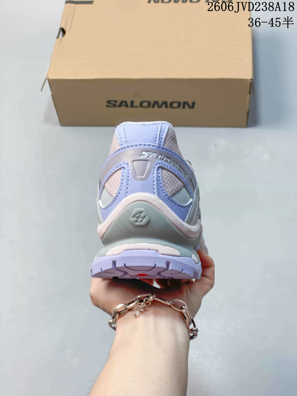 Rear view showing the heel structure and lavender outsole.