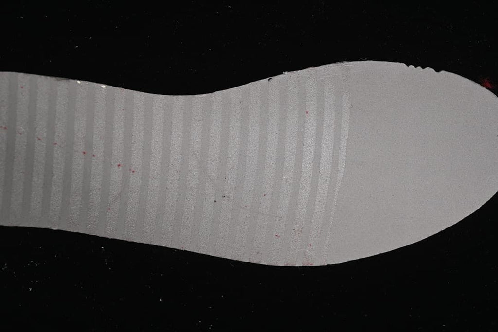 Underside of a white sneaker insole.