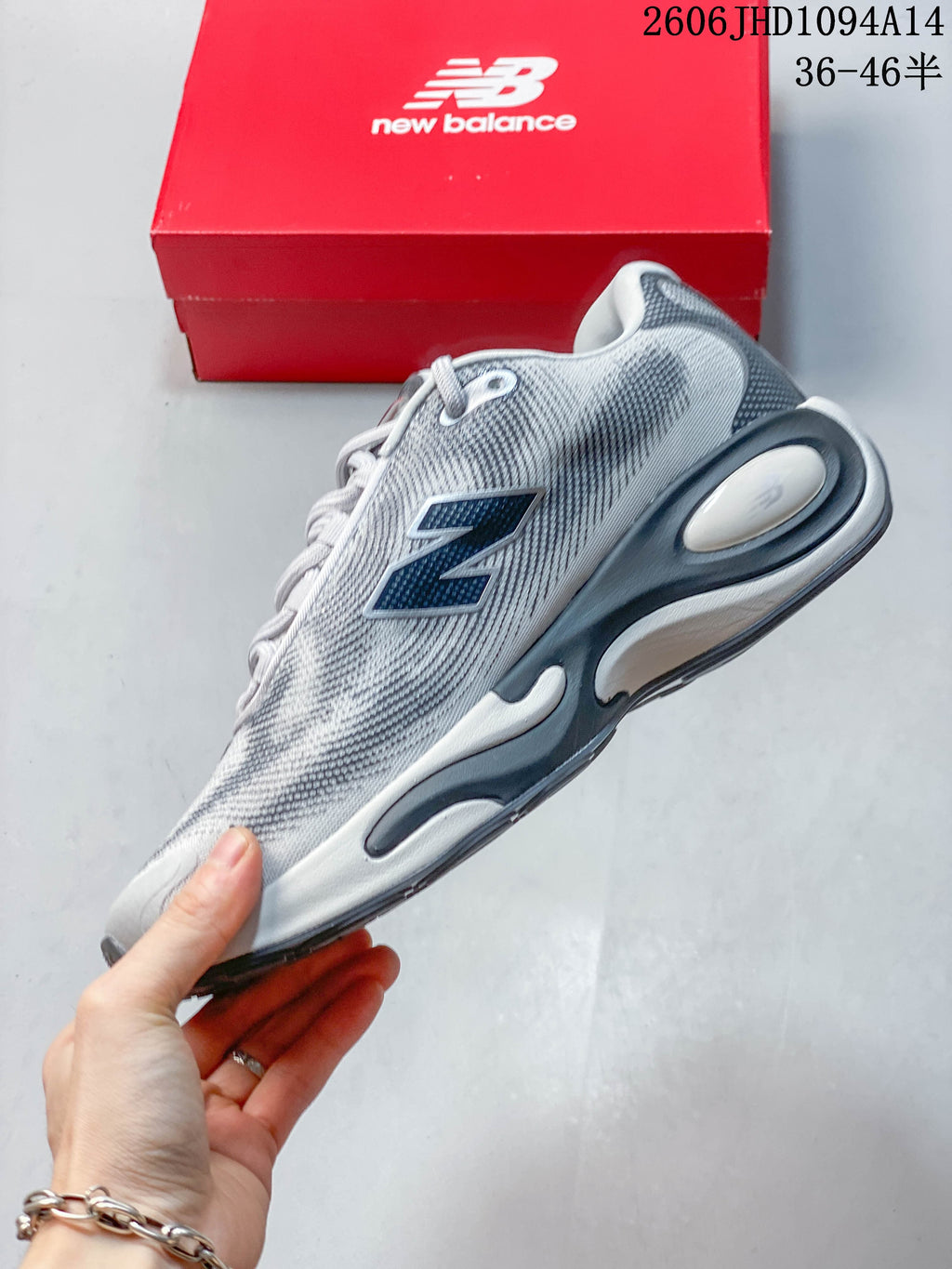 Side view of the gray sneaker with a prominent N logo