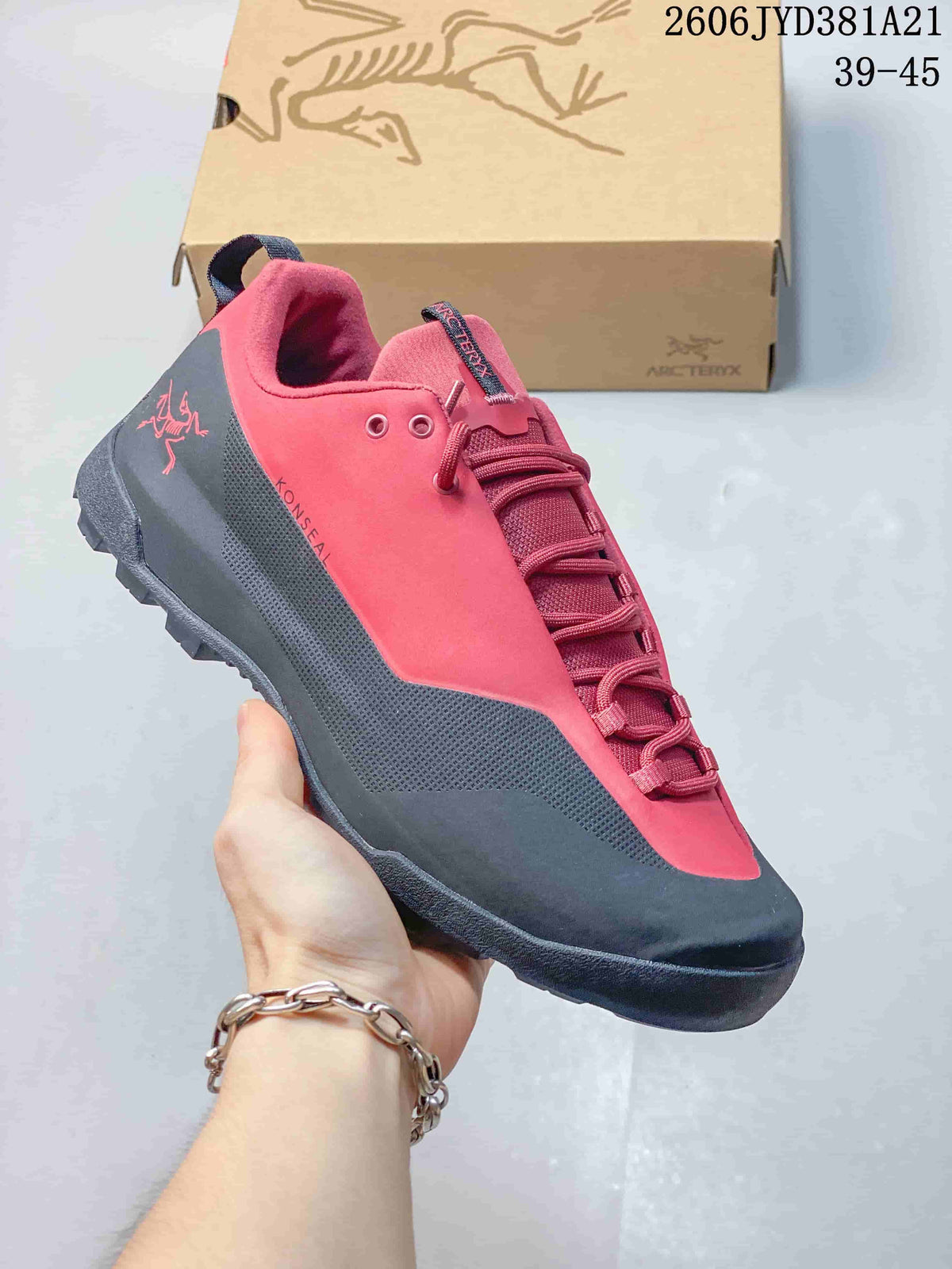 Red and dark gray Arc'teryx Konseal shoe with a lace-up closure