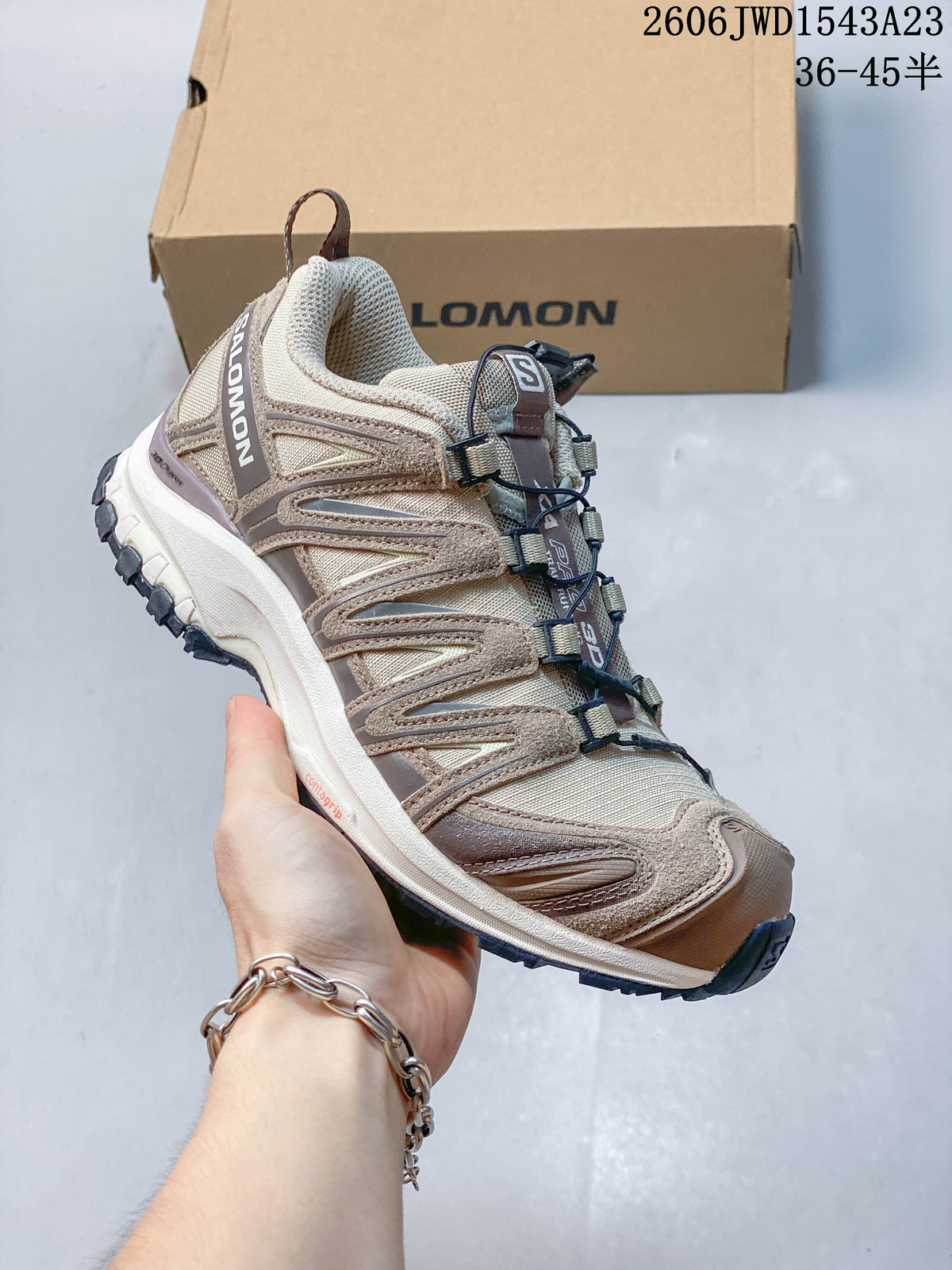 Side view of the beige Salomon XA Pro 3D shoe