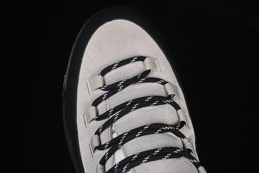Top-down close-up of the boot lacing and toe area