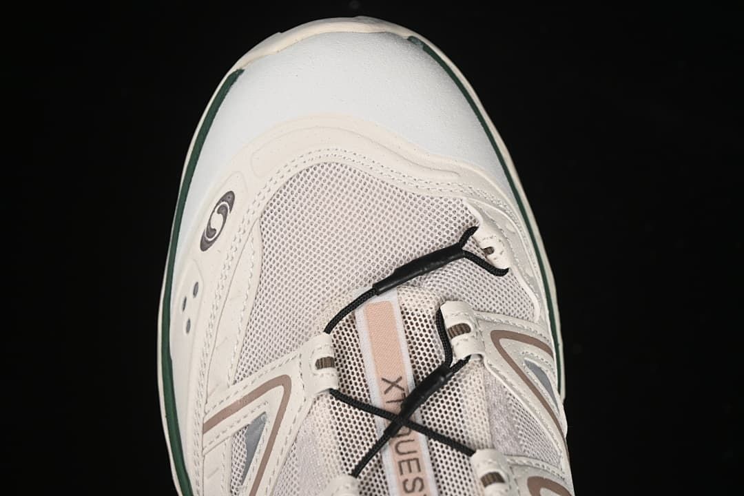 Top-front view showing the mesh-look upper, laces, and toe area.