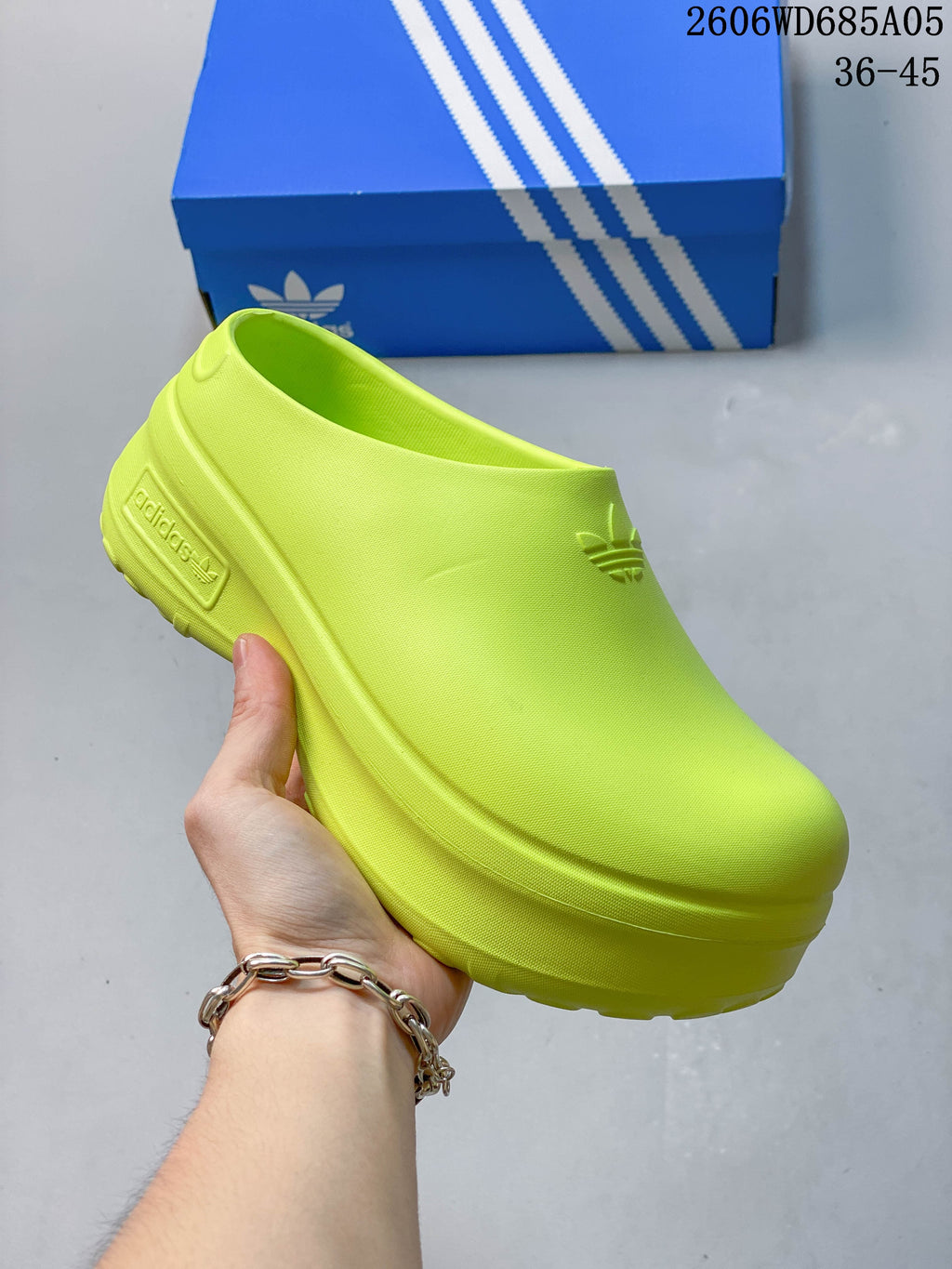 Cream Adidas mule clog with a raised platform sole