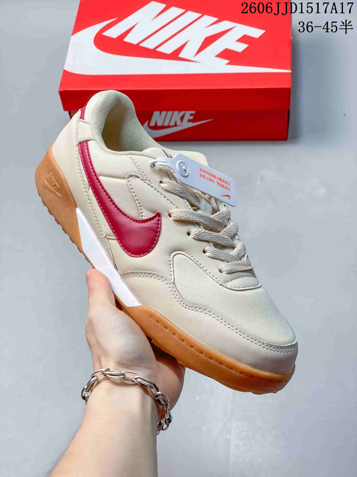 Angled side view of a Nike Terra Manta sneaker in cream with pink Swoosh and gum-colored sole