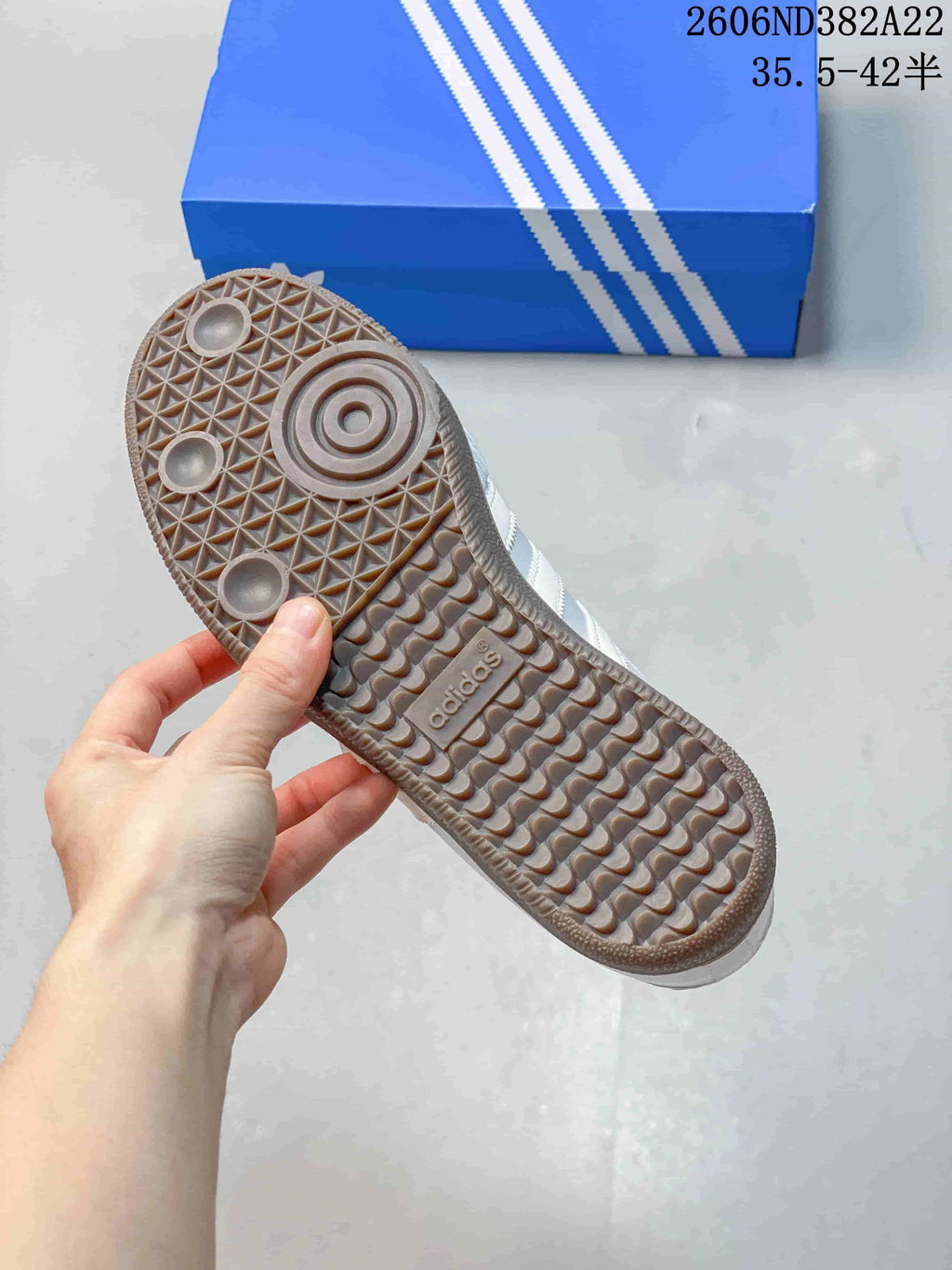 Close-up of the patterned gum-look outsole on an Adidas Samba Jane sneaker.
