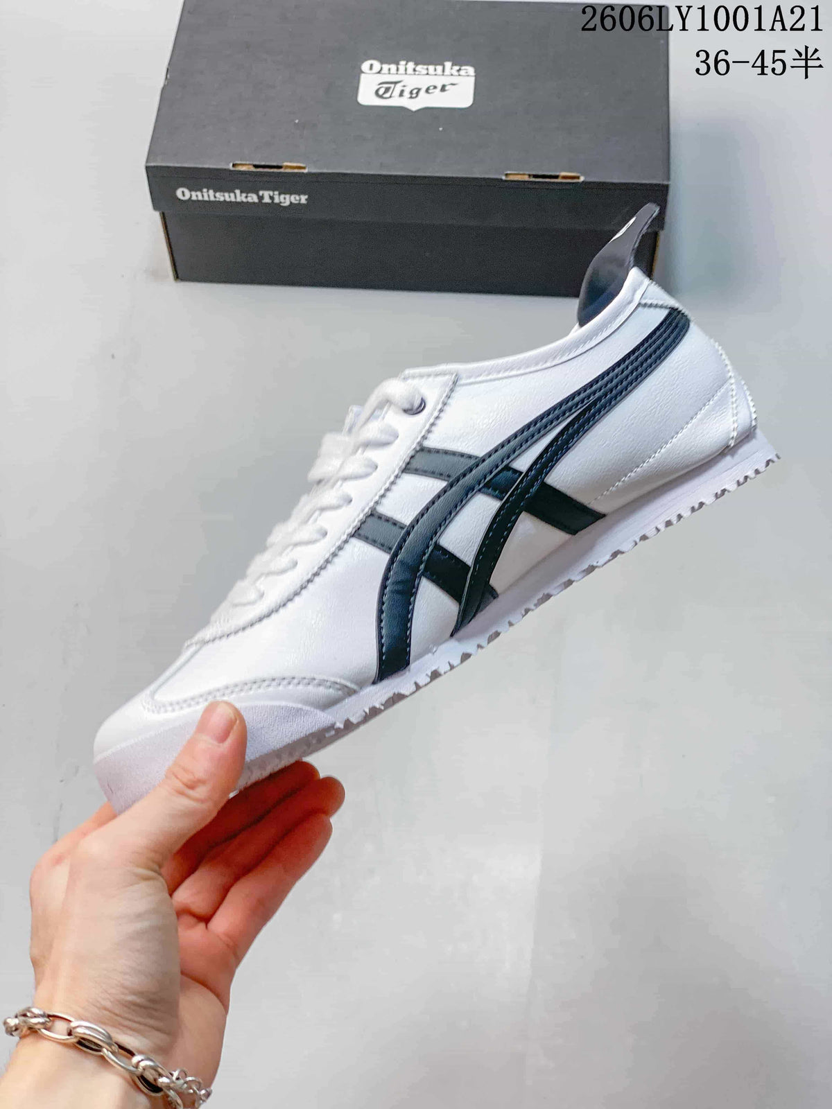 Side profile of a white Onitsuka Tiger Mexico 66 sneaker with dark navy stripes