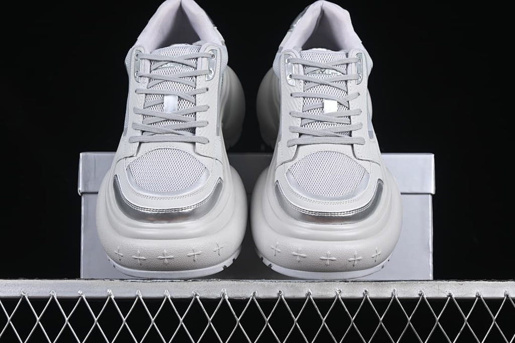 Front view of the pair showing lace-up fronts and silver-tone toe accents