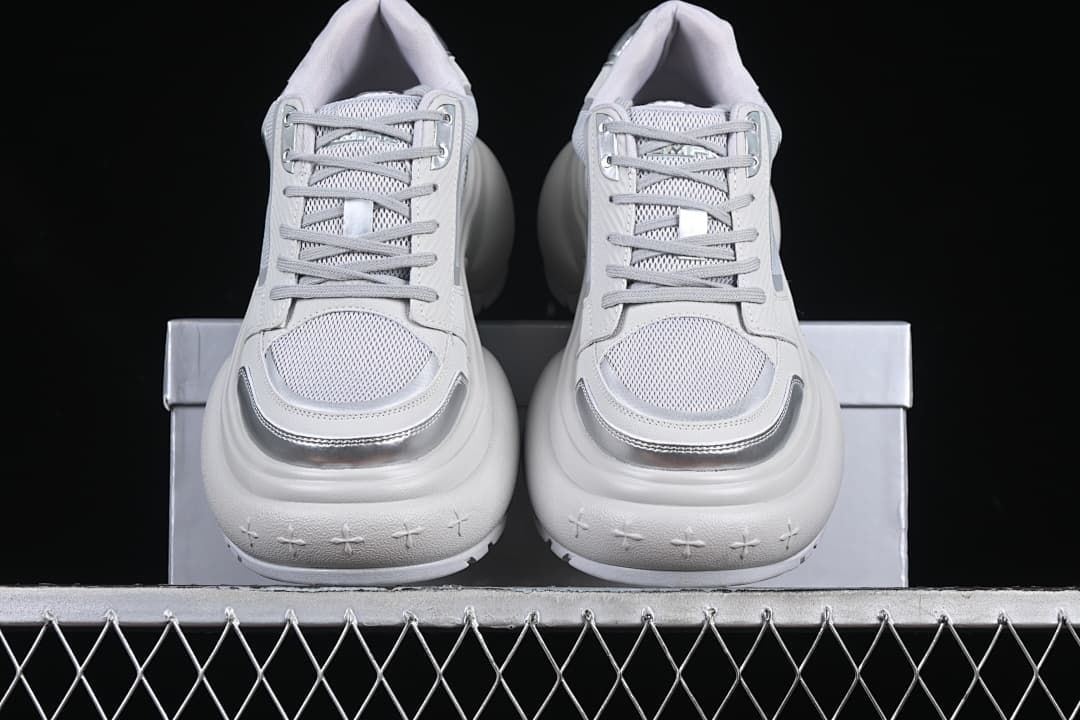 Front view of the pair showing lace-up fronts and silver-tone toe accents
