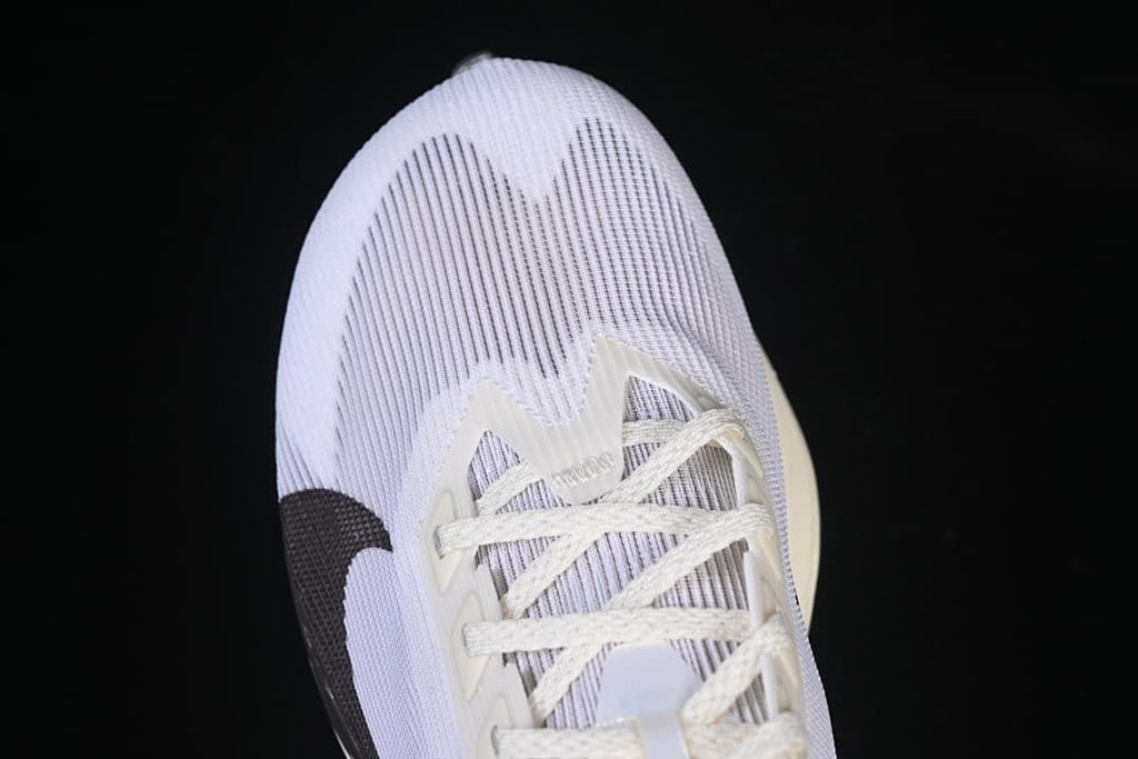 Top-down close-up of the white toe and lace area