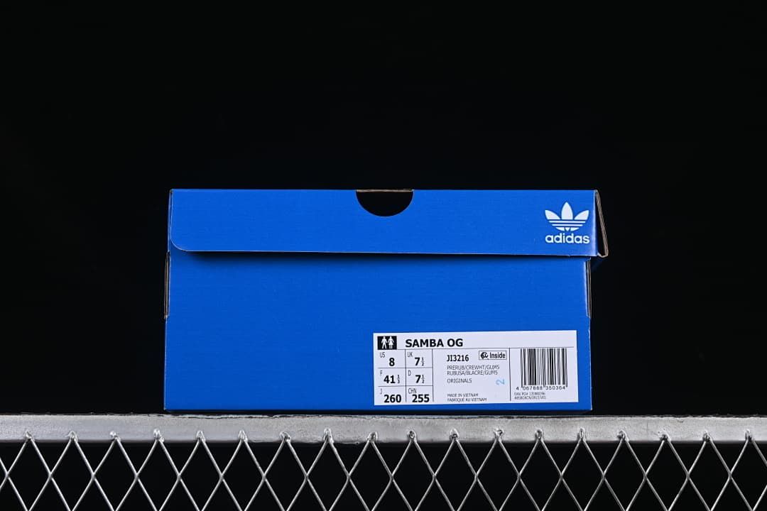 Blue shoe box labeled Samba OG and JI3216 with a sample size label