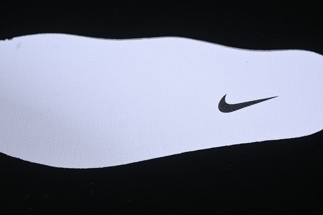 Close-up of a shoe insert with a Nike Swoosh