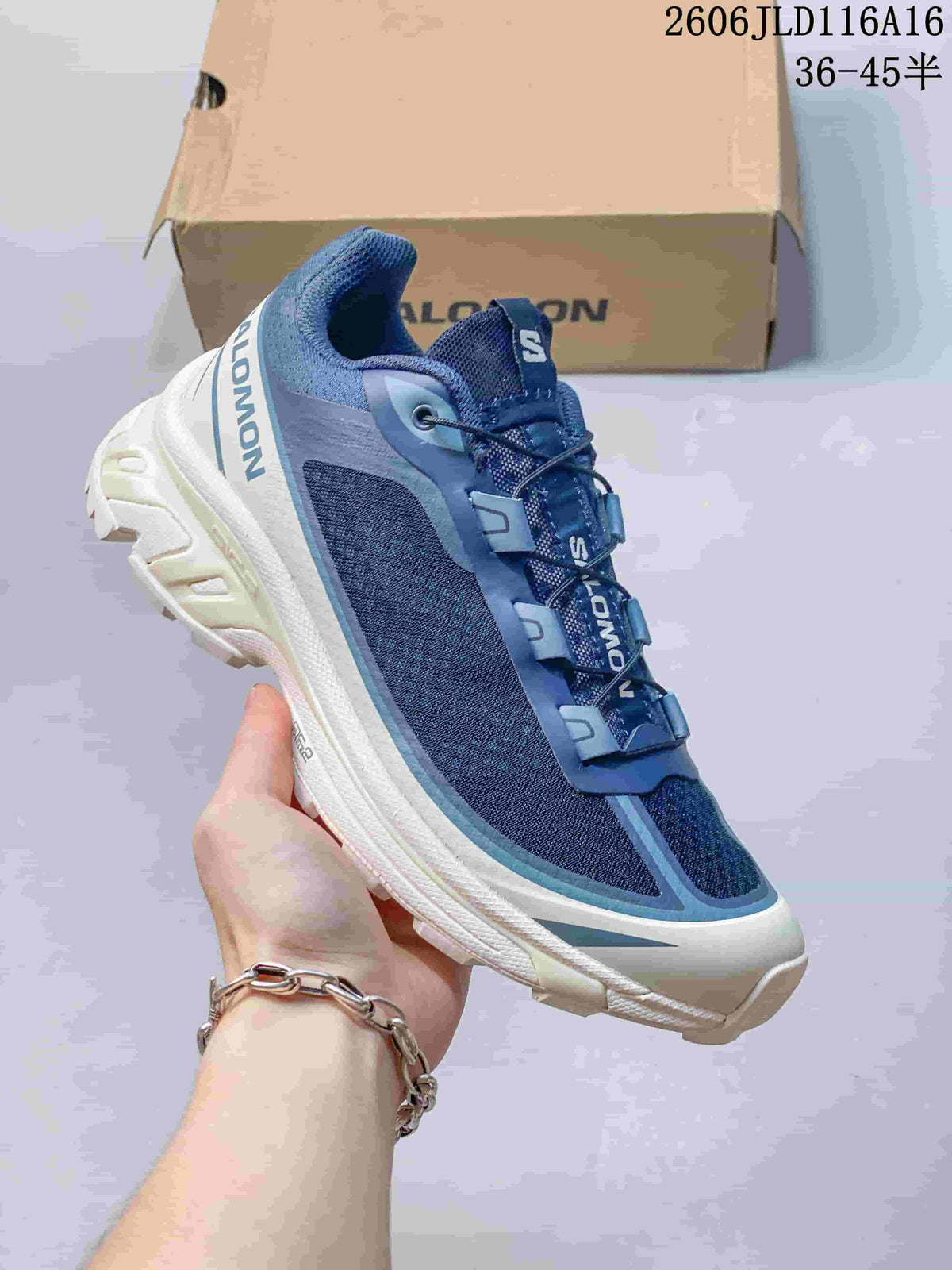 Angled side view of the blue and white sneaker