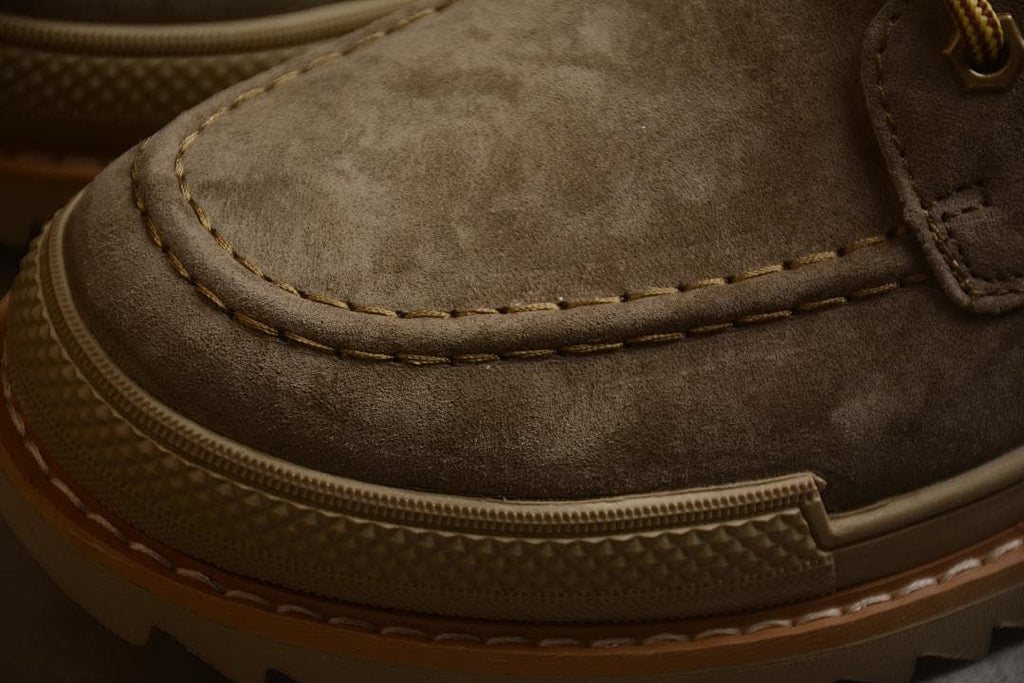 Close-up of moc-toe stitching and textured toe bumper
