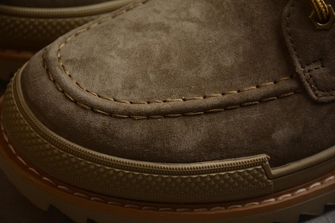 Close-up of moc-toe stitching and textured toe bumper
