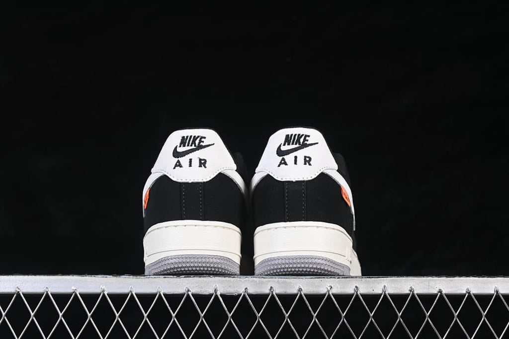 Rear view of the pair with white heel panels and gray outsoles