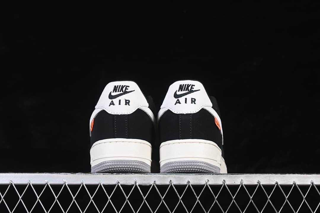Rear view of the pair with white heel panels and gray outsoles