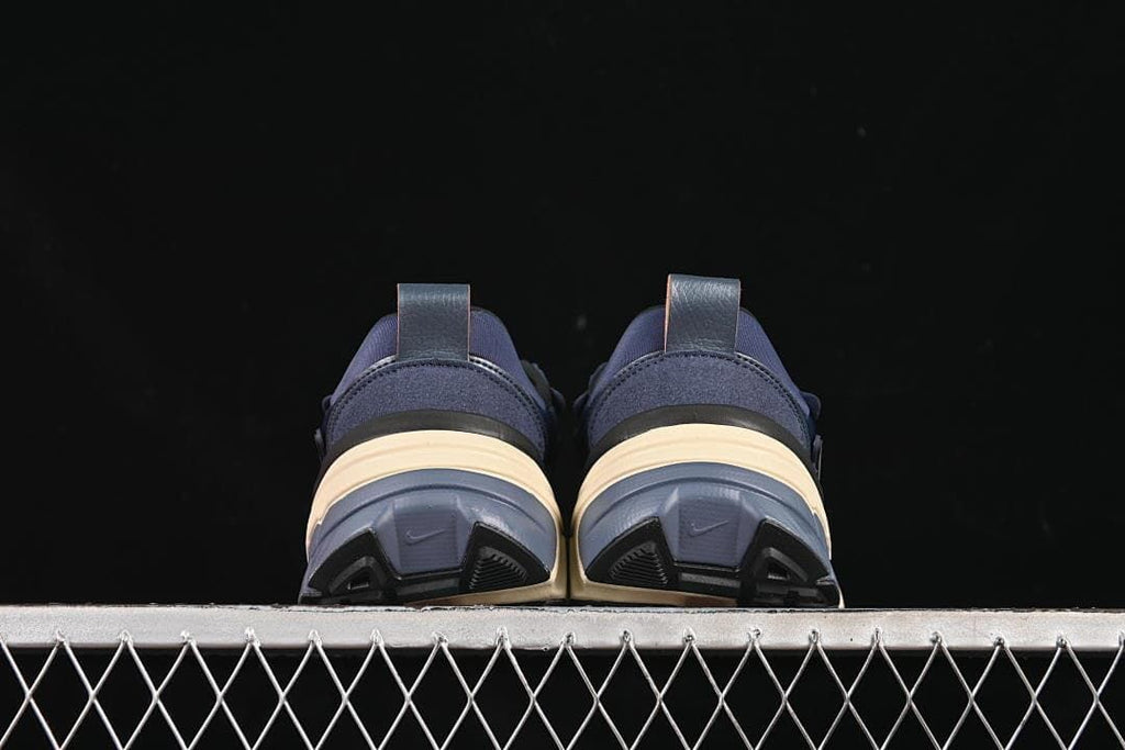 Rear view of the pair showing heel pulls and outsole details