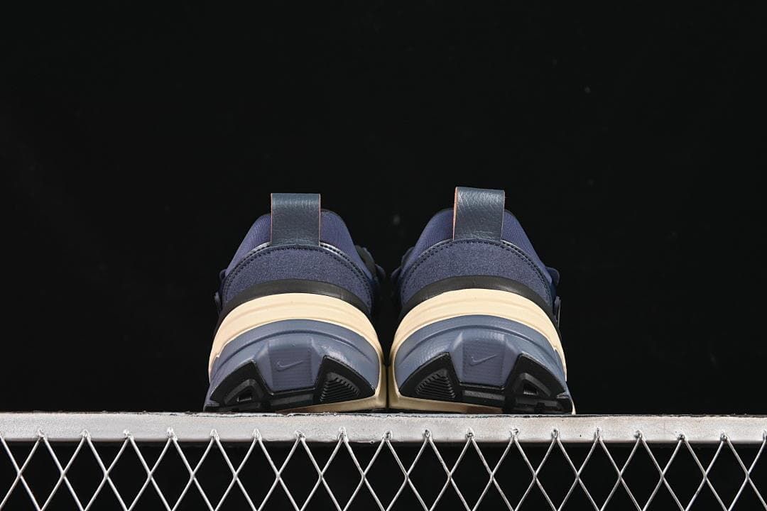 Rear view of the pair showing heel pulls and outsole details