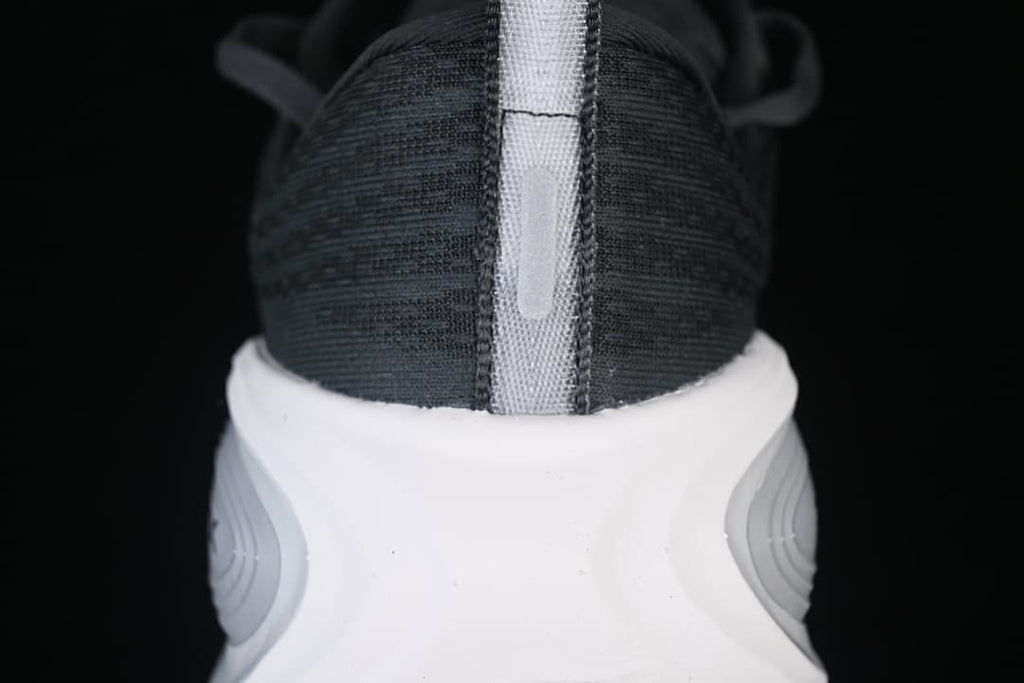 Rear view highlighting the shoe's heel pull tab and sculpted midsole.