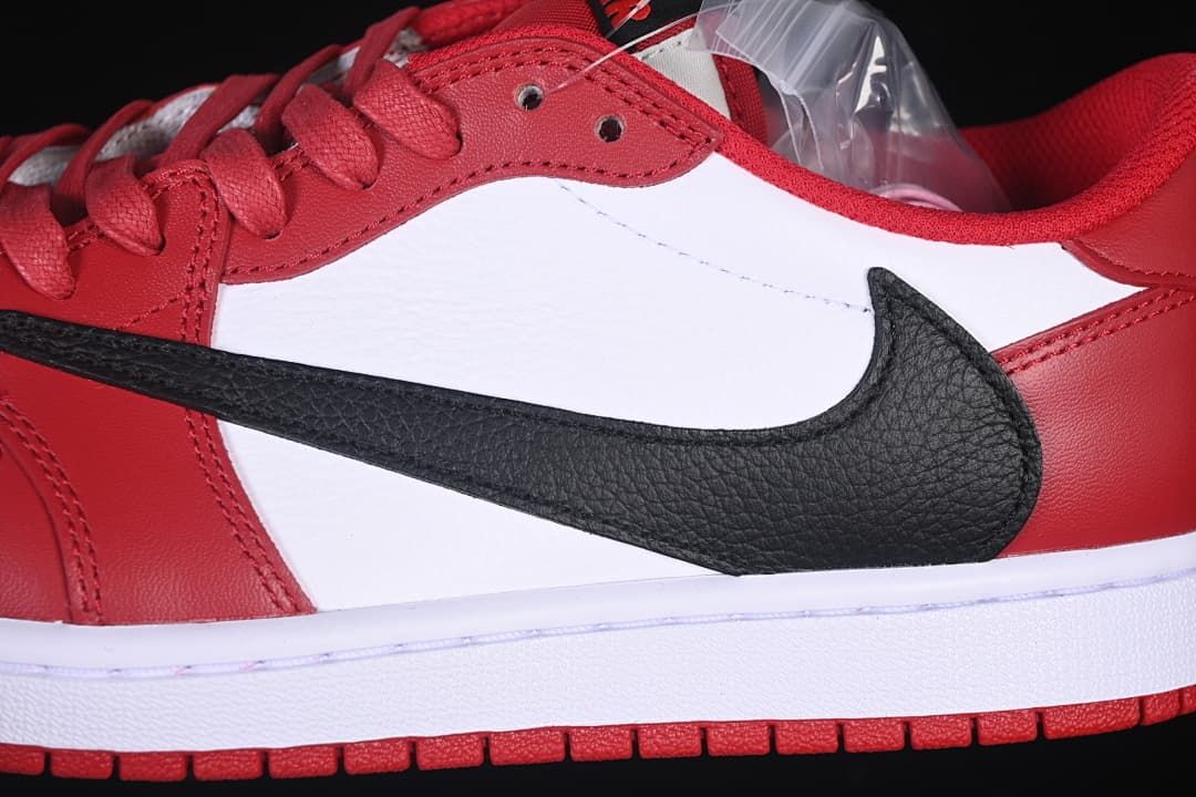 Close-up of the black side Swoosh on white and red panels