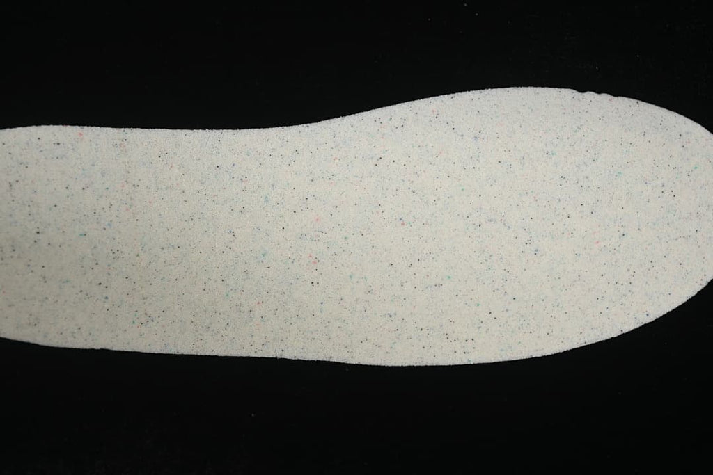 Light-colored shoe insole shown from above