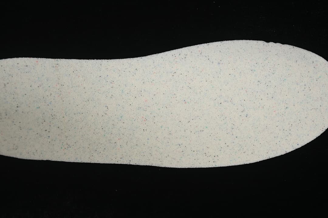 Light-colored shoe insole shown from above