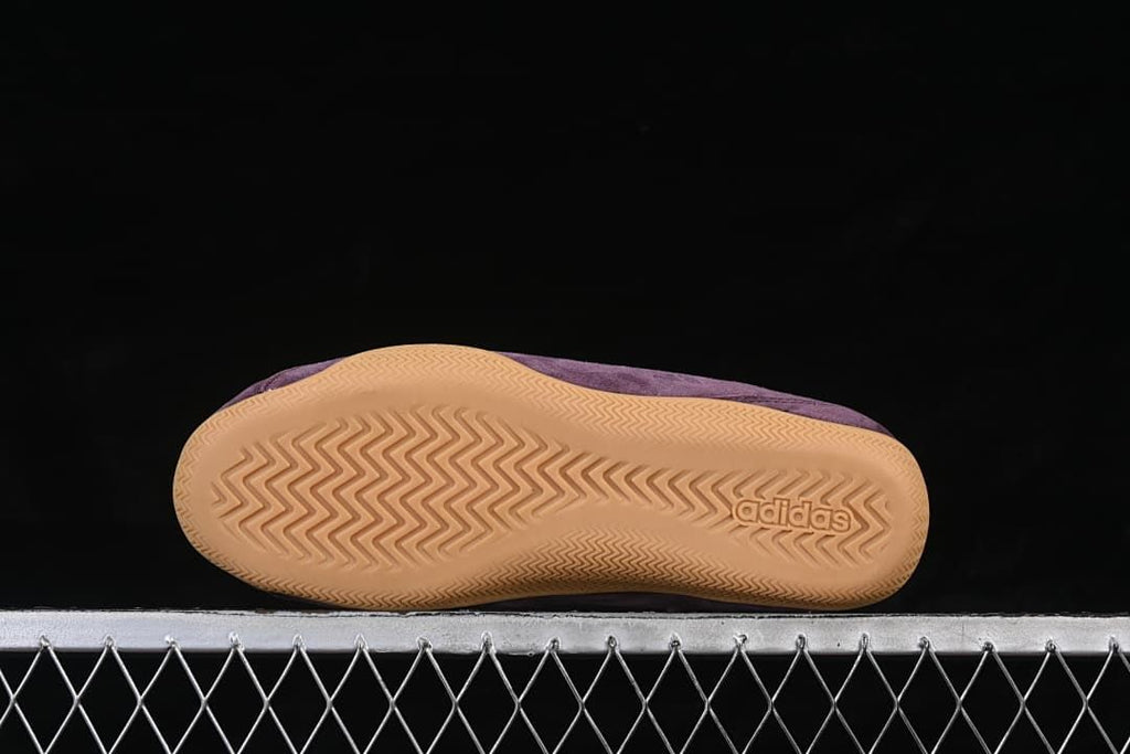 Underside of the gum-colored outsole with patterned tread