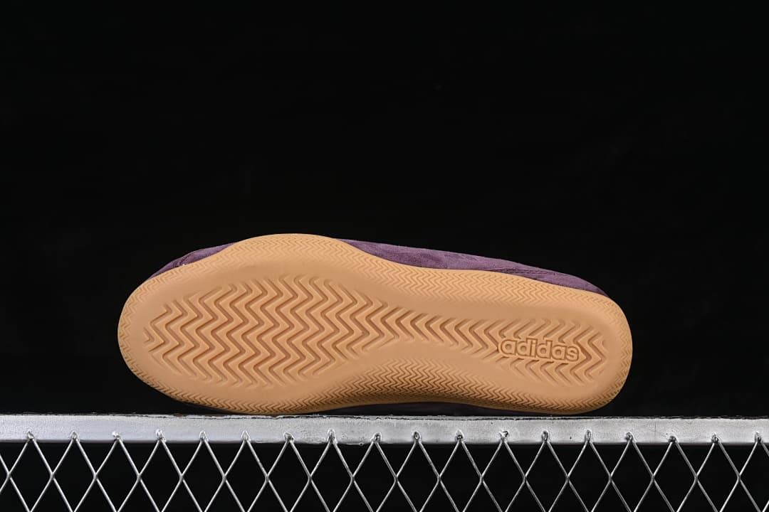 Underside of the gum-colored outsole with patterned tread