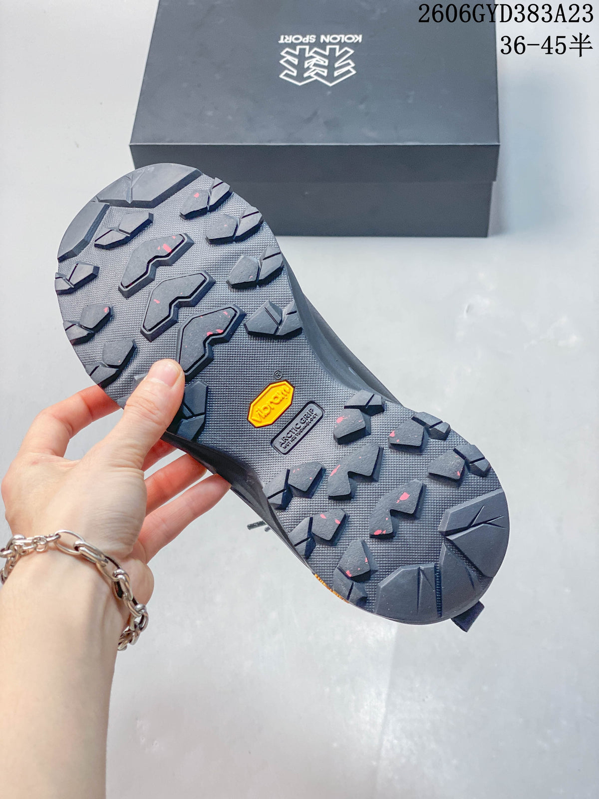 Close-up of the lugged outsole with Vibram branding