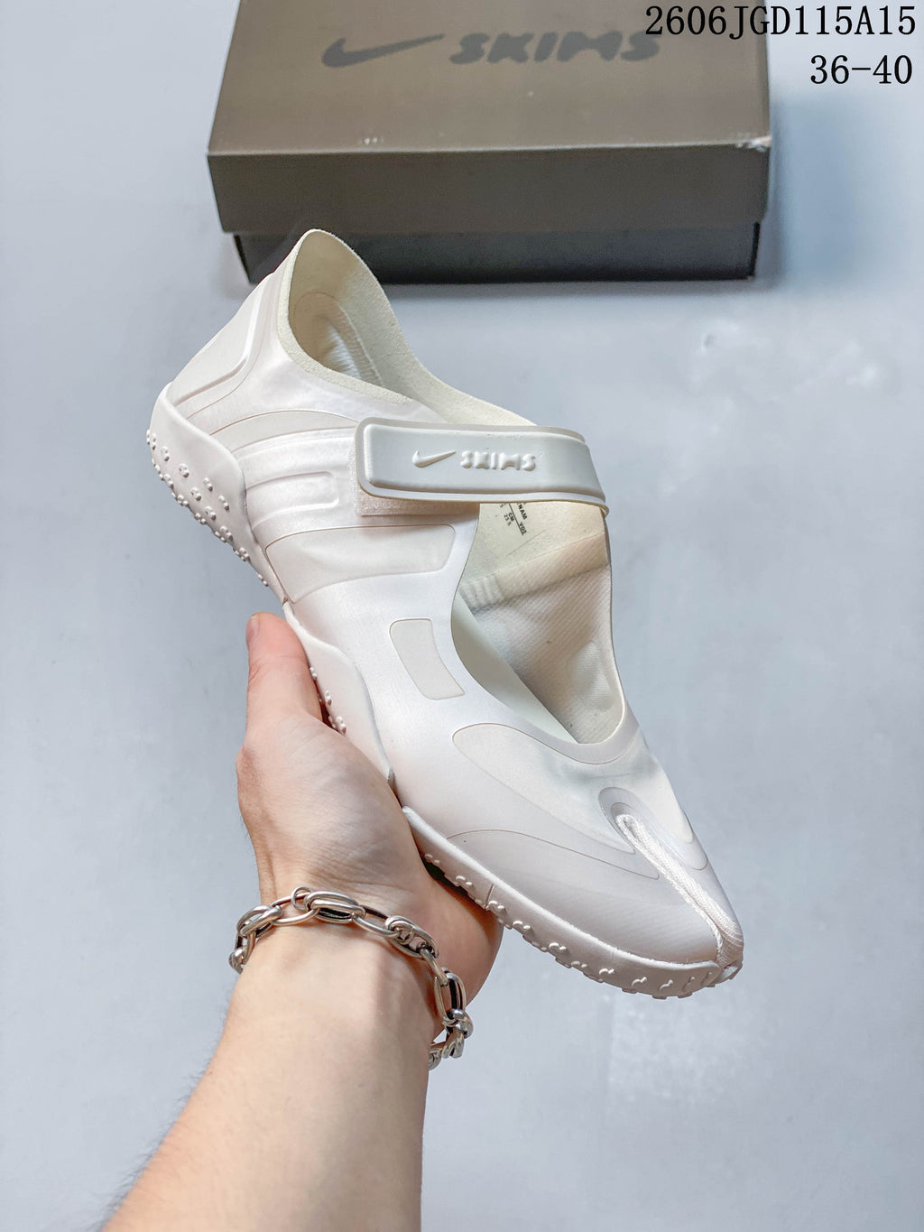 Angled view of a pale Nike Air Rift shoe showing its strap closure