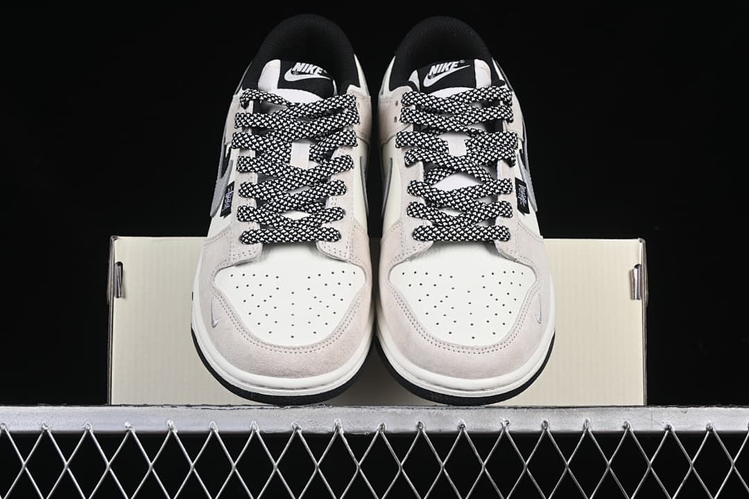 Front view of the pair showing perforated toes and patterned laces