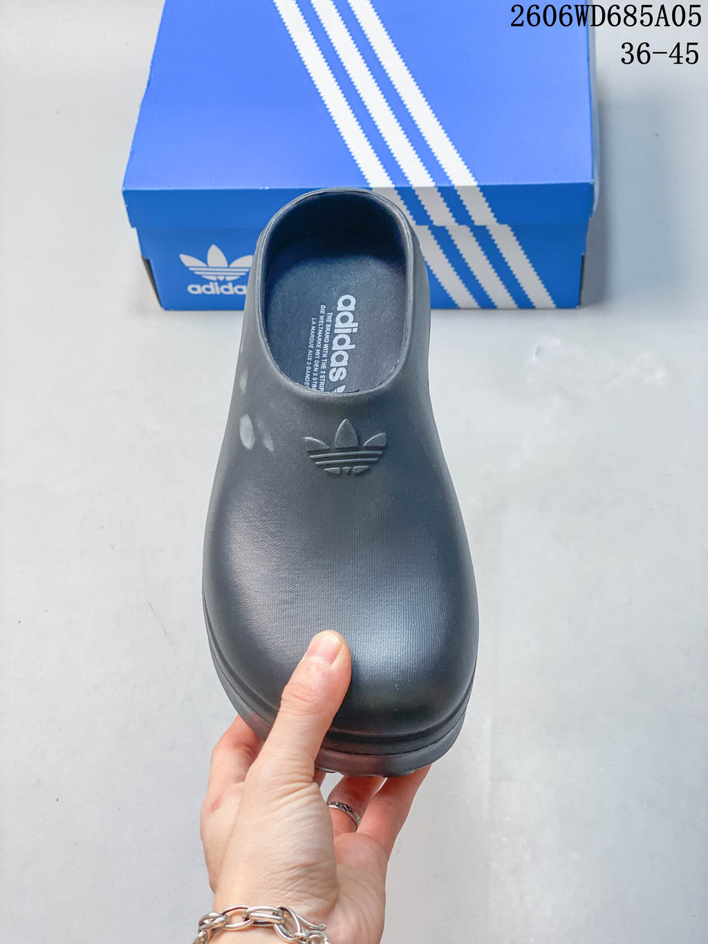 Top view of the closed-toe mule with Adidas branding