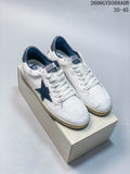 Pair of white Golden Goose Super-Star style sneakers with navy stars and distressed-look detailing