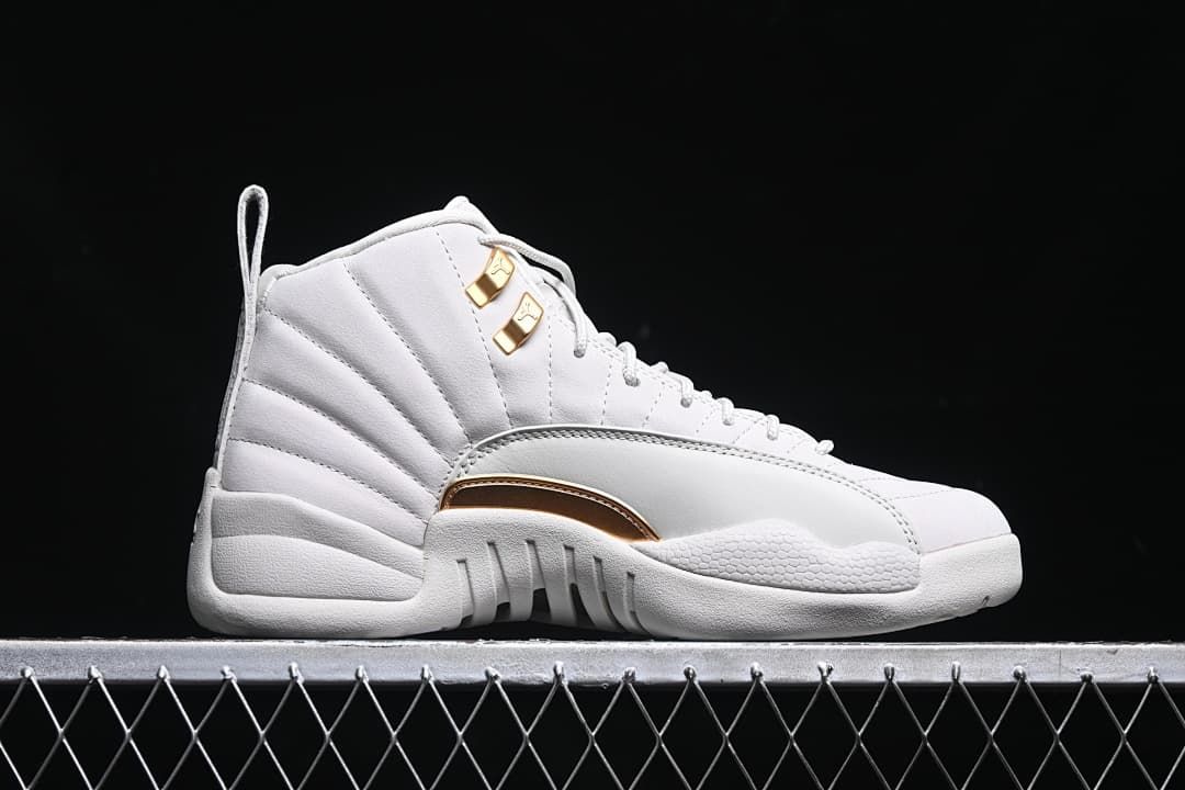 Outer side view of a white high-top sneaker with gold-tone accents