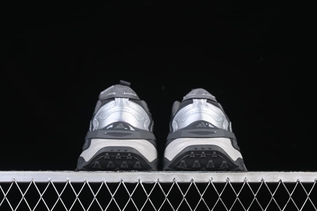 Rear view of both sneakers showing heel and outsole details.