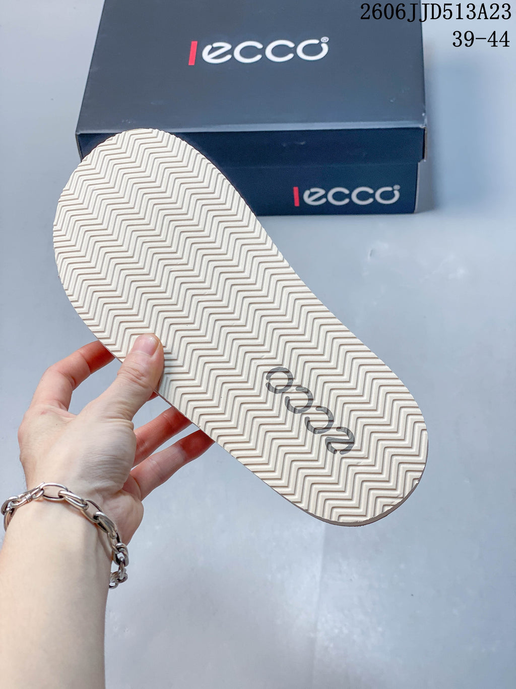 Close-up of the sandal outsole with a zigzag tread pattern.