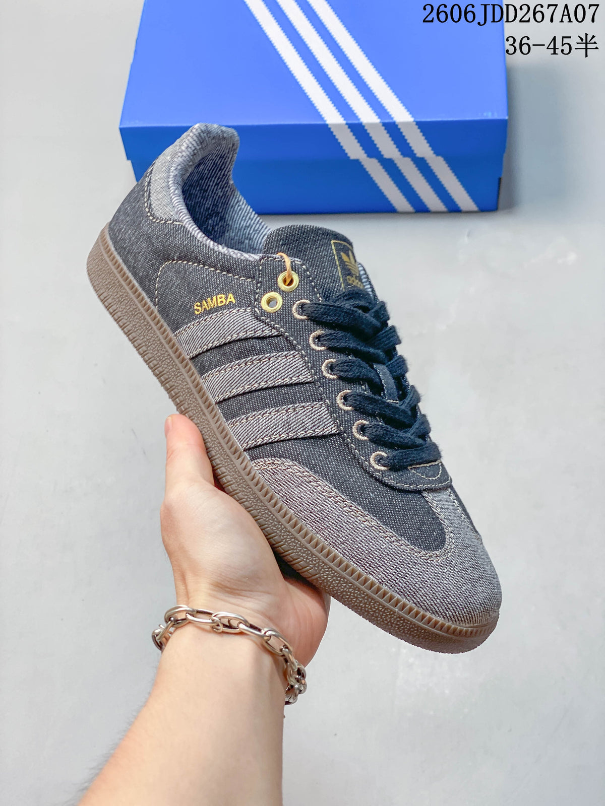 Close-up of a gray denim-look Samba sneaker showing contrasting stripes, lace-up front and gum-look sole