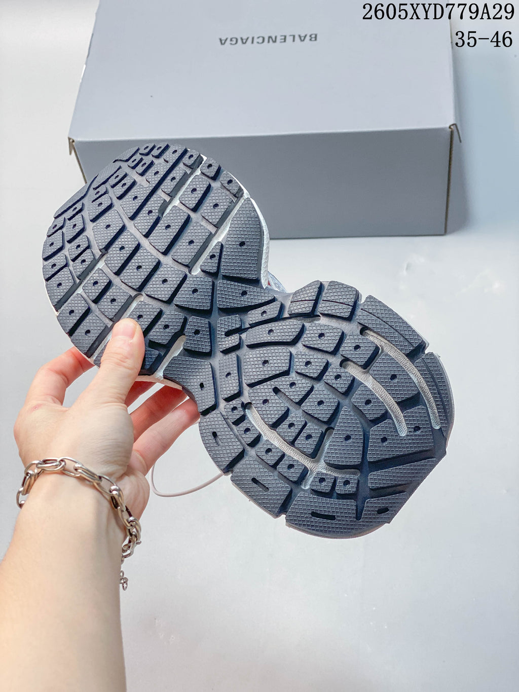 Close-up of the dark, segmented outsole on a Balenciaga Phantom sneaker.