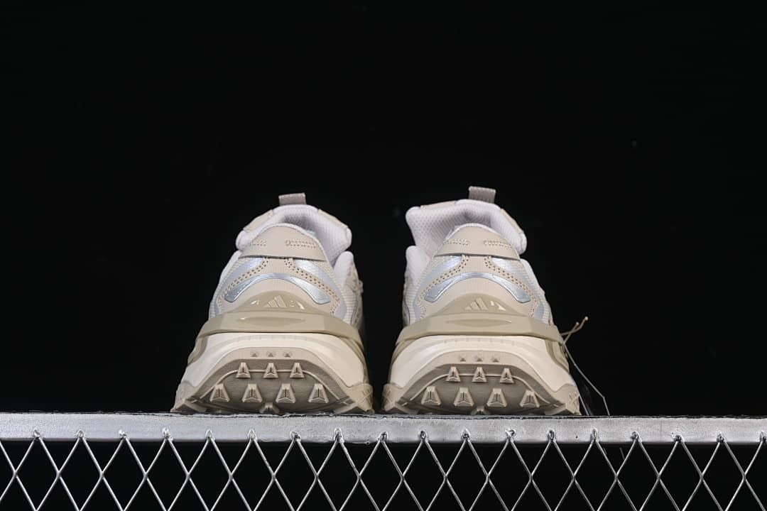 Rear view of the pair showing heel details and outsole tread