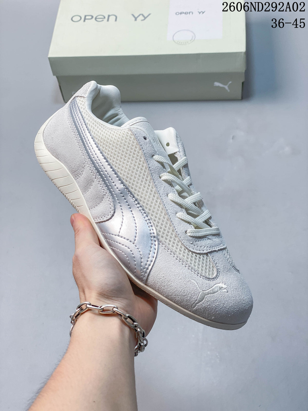 White and light gray Puma Speedcat The Open YY sneaker with a mesh-look panel