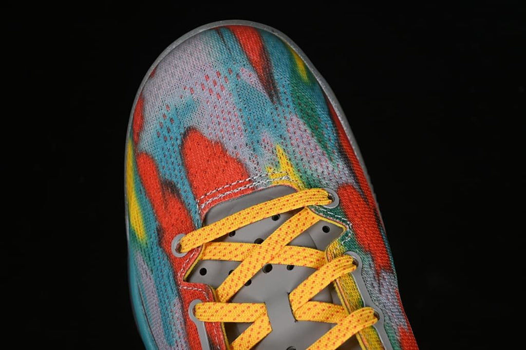 Top view of the multicolor patterned toe and yellow laces