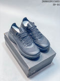 Pair of dark gray Arc'teryx Konseal SL 2 low-cut outdoor shoes on a shoebox