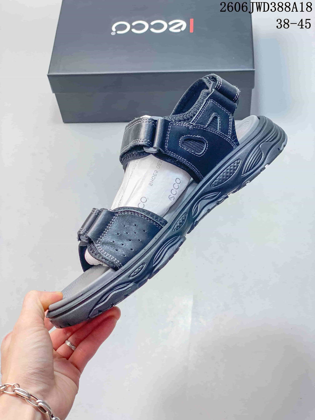 Side view of an ECCO sandal with adjustable straps and a textured sole