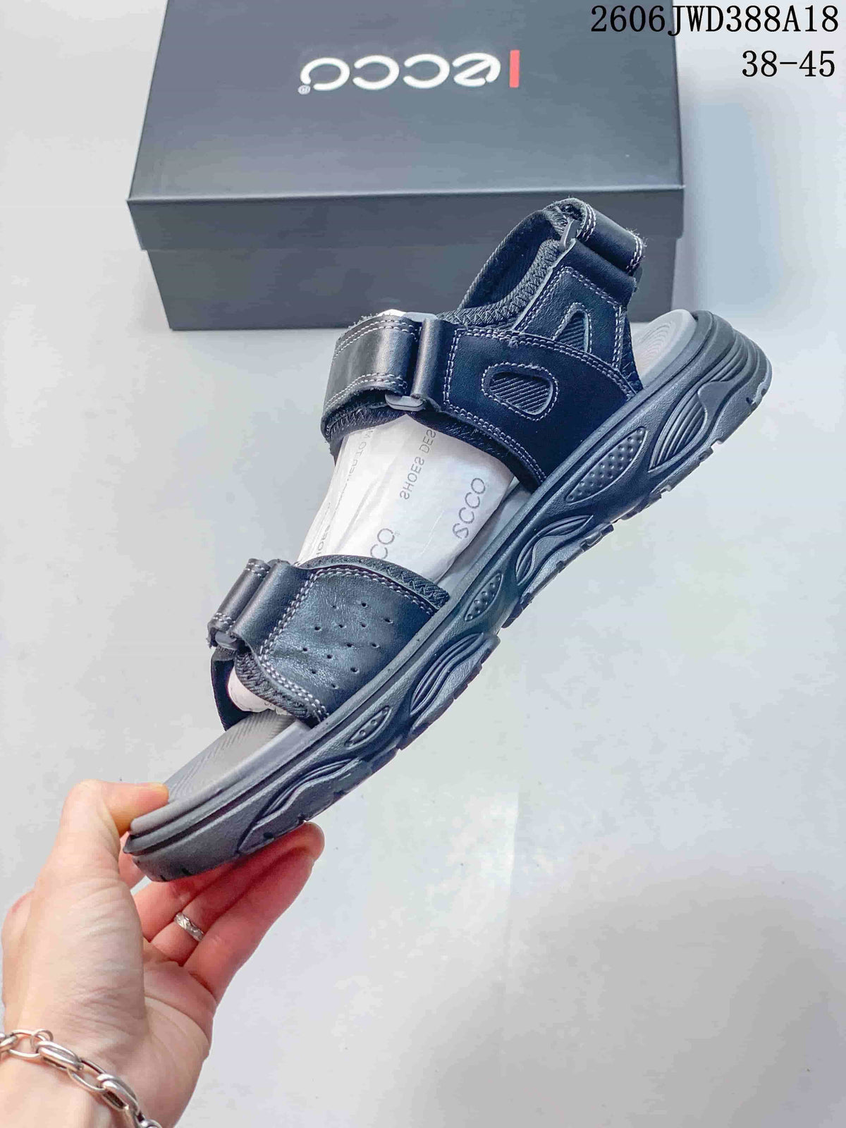 Side view of an ECCO sandal with adjustable straps and a textured sole
