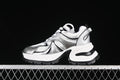 Side view of silver, white, and black GCDS G24X4338 chunky sneakers