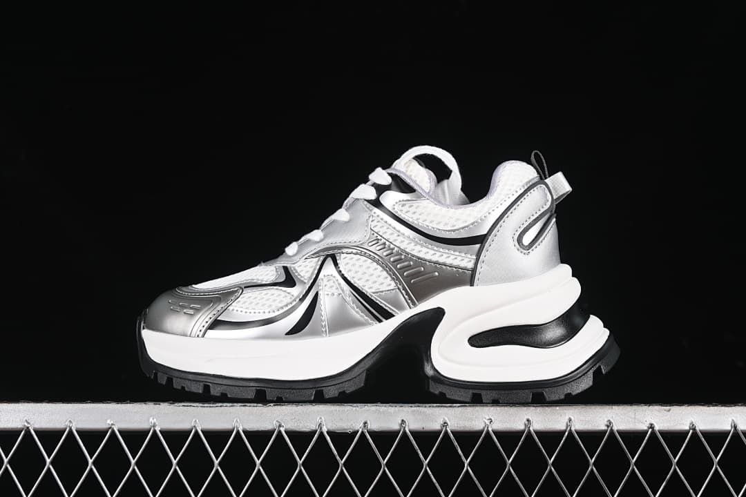 Side view of silver, white, and black GCDS G24X4338 chunky sneakers