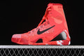 Side view of a bright crimson Nike Kobe 9 Elite Protro High shoe with black swoosh and white outsole accents