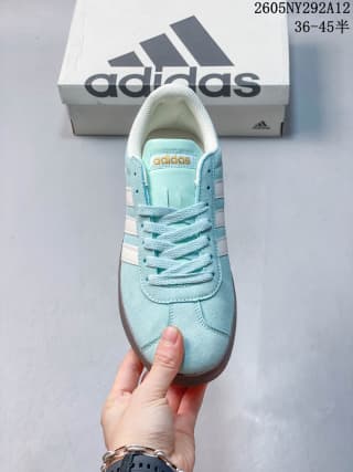 Top view showing the lace-up vamp, tongue branding, and off-white side stripes.